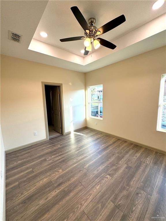 2810 Stablewood Mission, TX 78574 - Photo 15 of 18 a view of an empty room with a window and wooden floor