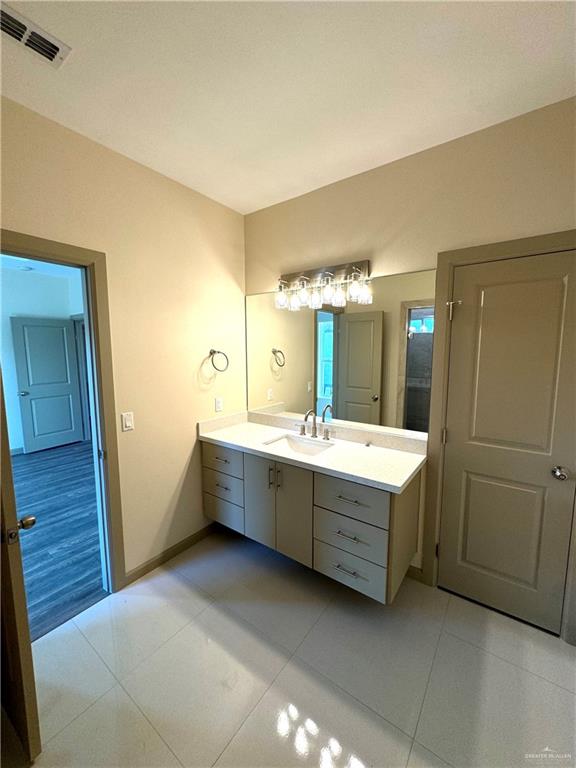 2810 Stablewood Mission, TX 78574 - Photo 16 of 18 a bathroom with a double vanity sink and mirror