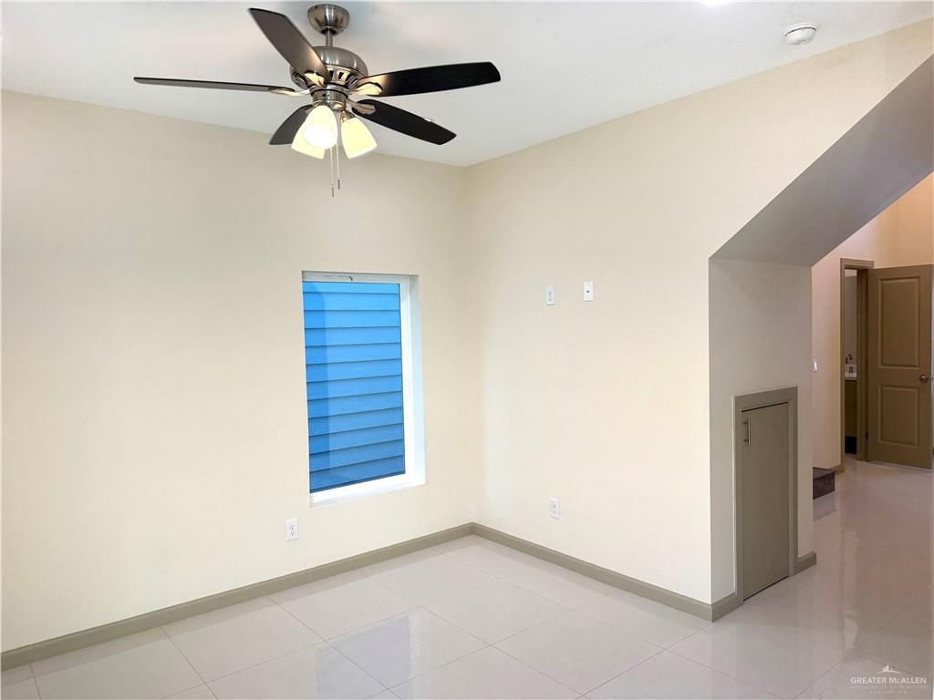 2810 Stablewood Mission, TX 78574 - Photo 4 of 18 a view of an empty room with a ceiling fan