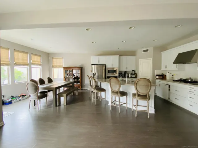 a view of a dining room with furniture window and outside view