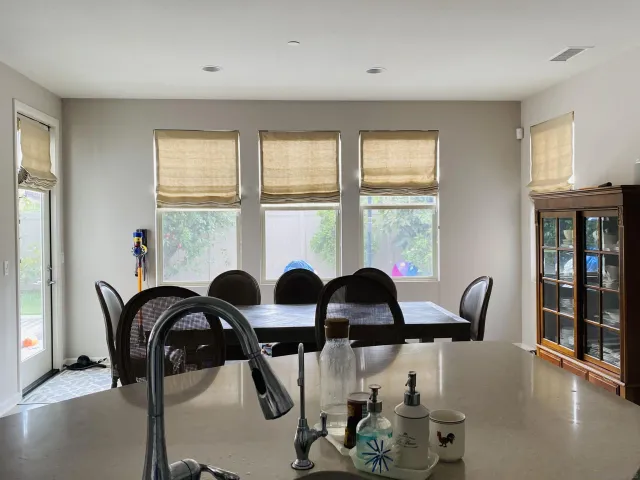 a view of a dining room with furniture window and outside view