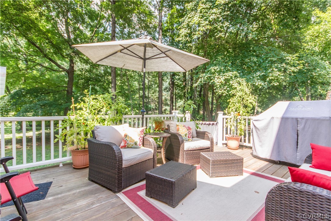 14010 Fiddlers Ridge Road Midlothian, VA 23112 - Photo 13 of 36 a outdoor living space with furniture and a umbrella