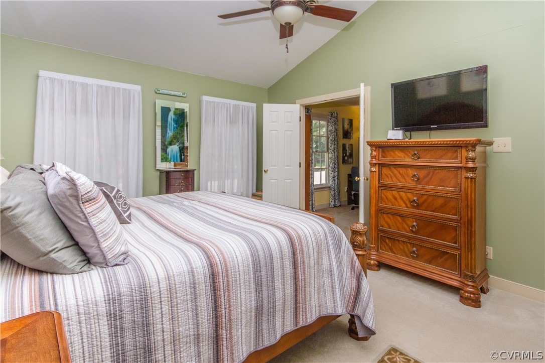 14010 Fiddlers Ridge Road Midlothian, VA 23112 - Photo 19 of 36 a bedroom with a bed and a flat tv screen on dresser