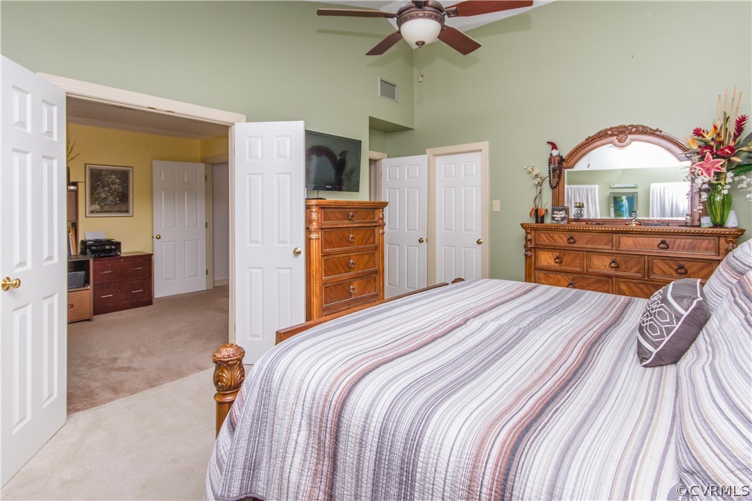 14010 Fiddlers Ridge Road Midlothian, VA 23112 - Photo 20 of 36 a bedroom with a bed and a chandelier