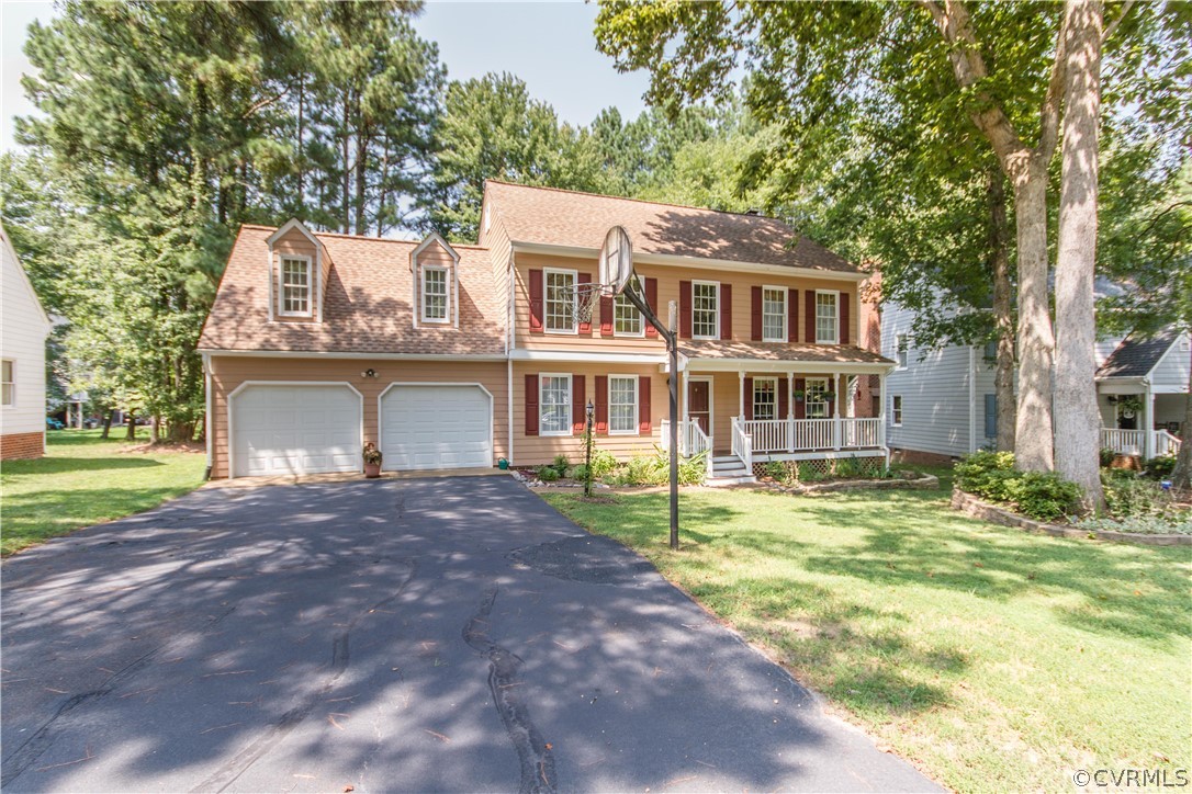 14010 Fiddlers Ridge Road Midlothian, VA 23112 - Photo 2 of 36 a front view of a house with a garden