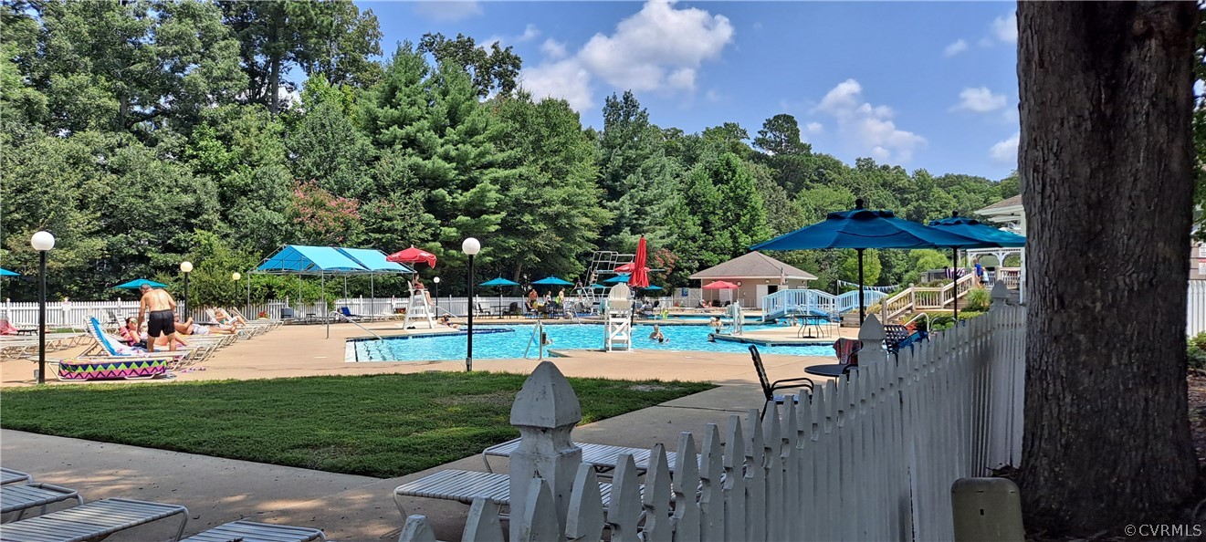 14010 Fiddlers Ridge Road Midlothian, VA 23112 - Photo 34 of 36 a view of a swimming pool and lounge chairs