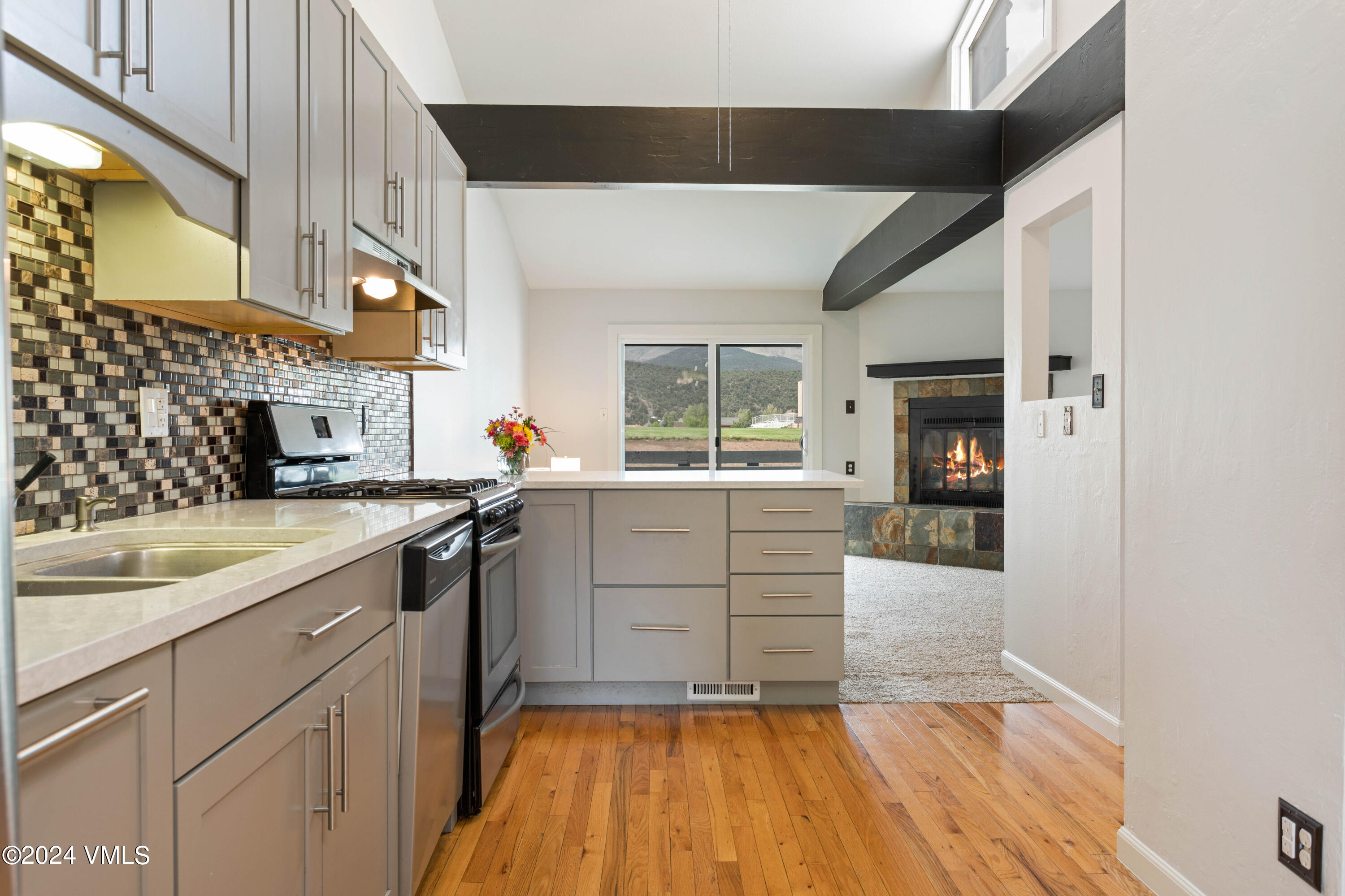 a kitchen with a sink and cabinets
