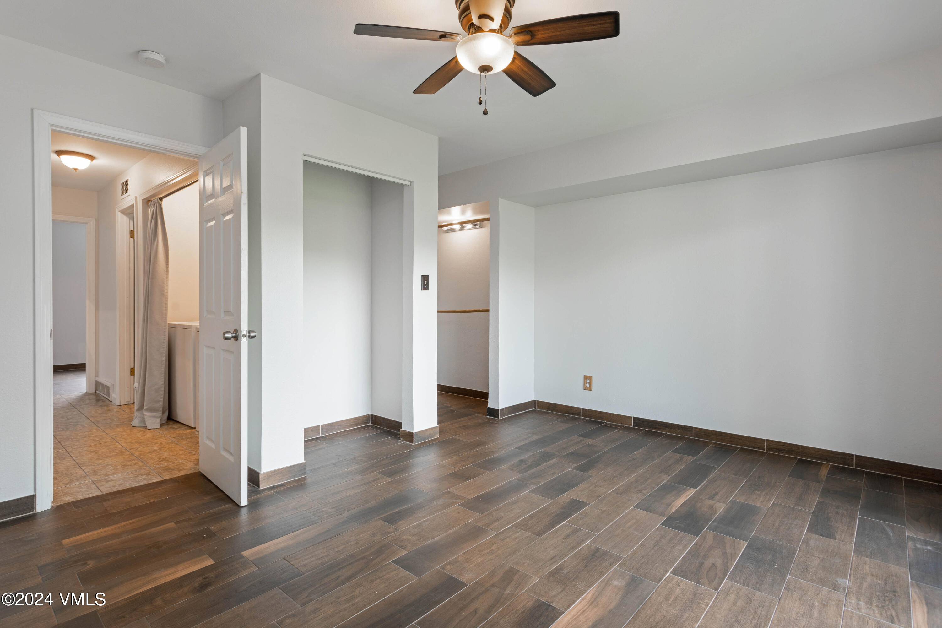 528 East 3rd Street Eagle, CO 81631 - Photo 12 of 17 wooden floor in an empty room with a window