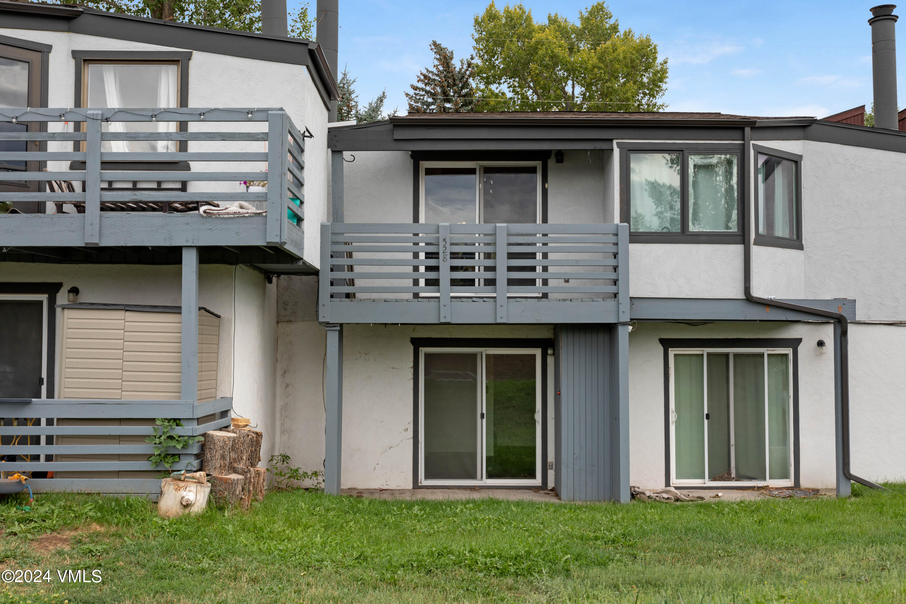 528 East 3rd Street Eagle, CO 81631 - Photo 17 of 17 a front view of a house with a garden and plants
