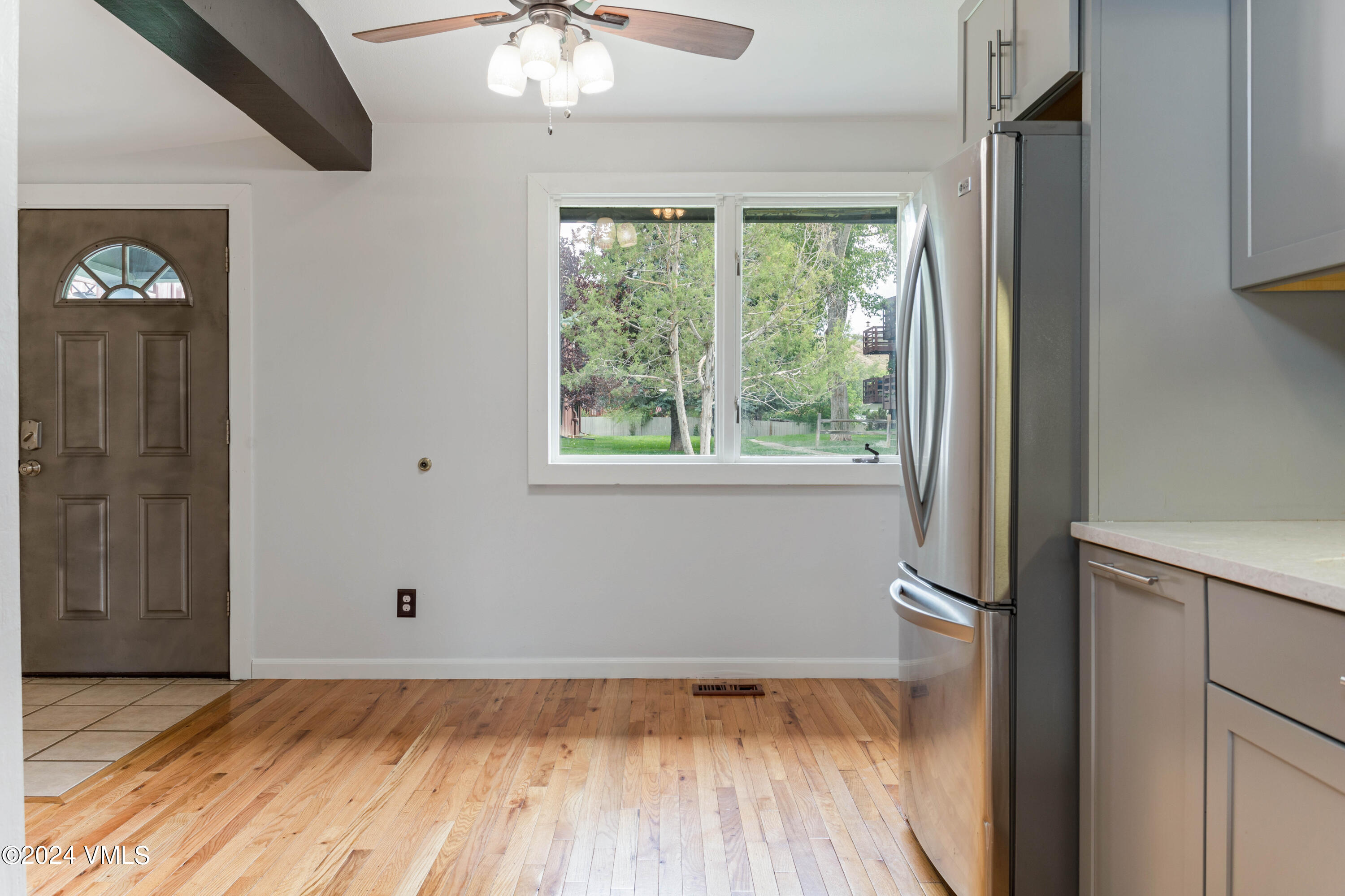 528 East 3rd Street Eagle, CO 81631 - Photo 4 of 17 a view of empty room with window and wooden floor