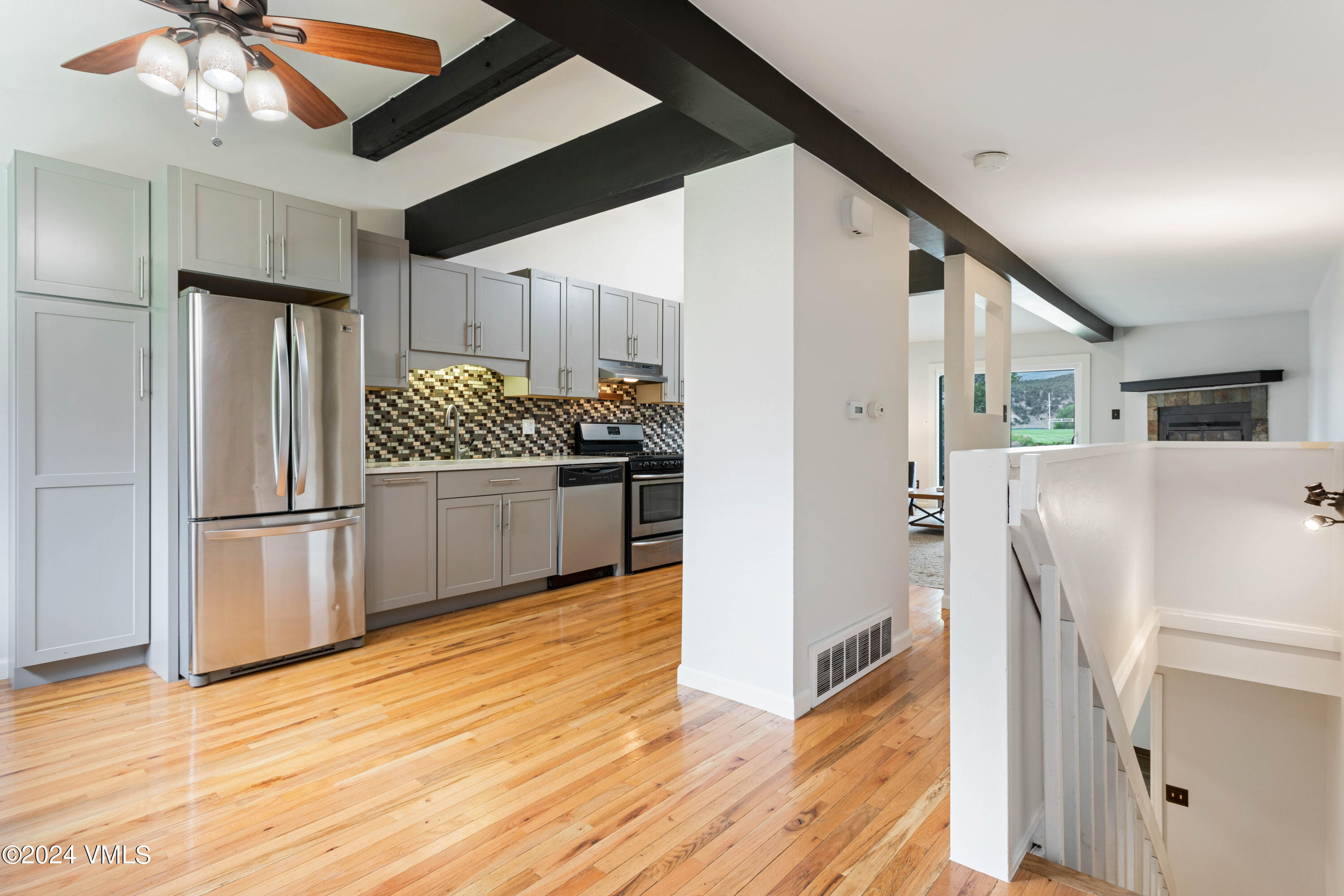 528 East 3rd Street Eagle, CO 81631 - Photo 5 of 17 a kitchen with stainless steel appliances a refrigerator and wooden floor