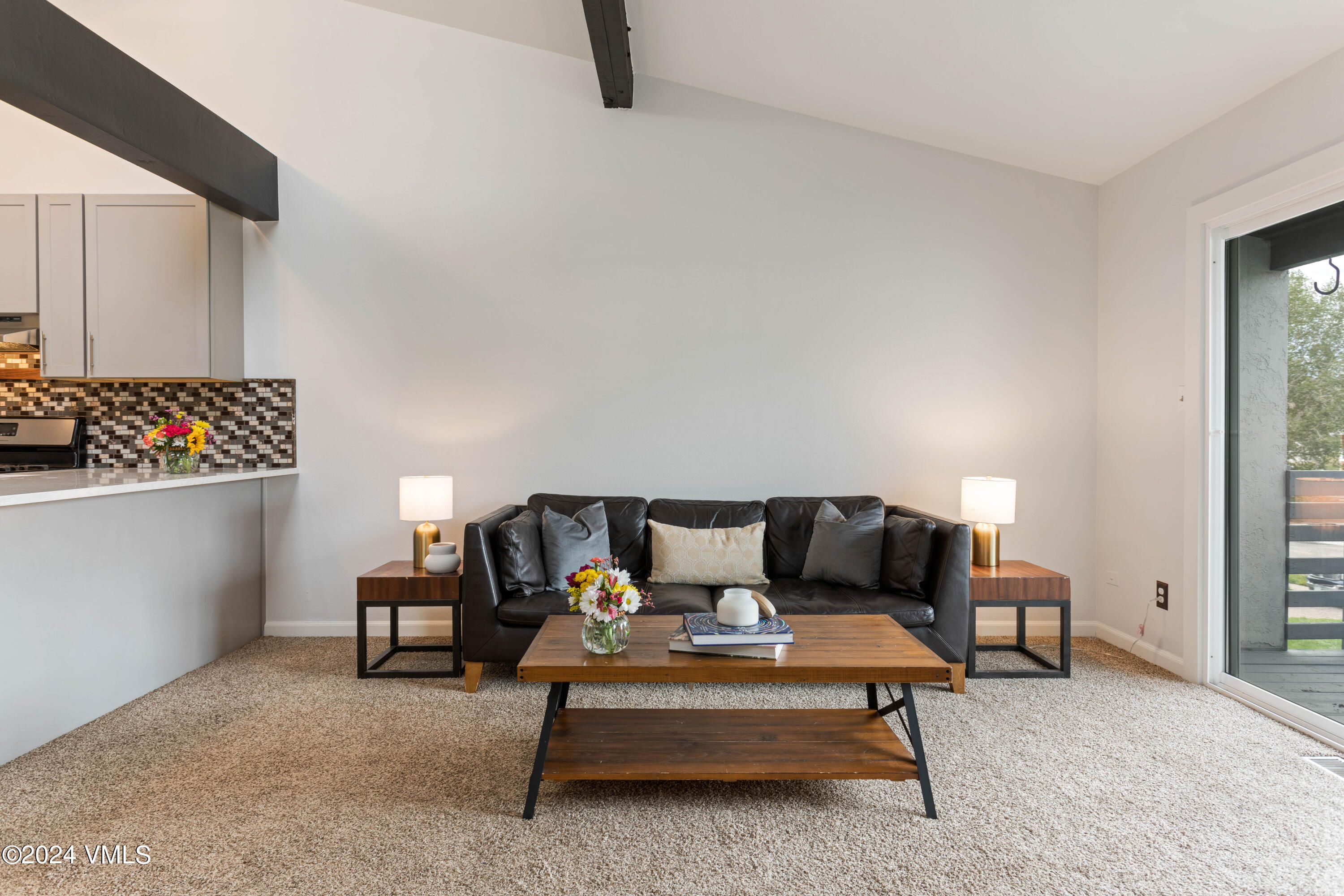 528 East 3rd Street Eagle, CO 81631 - Photo 7 of 17 a living room with furniture and a lamp