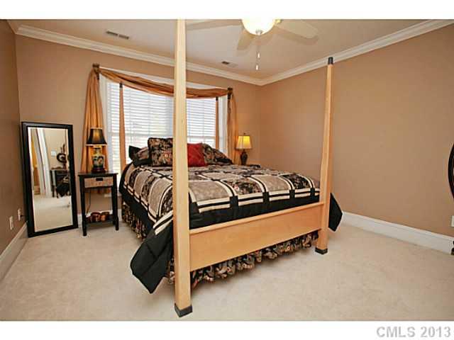 501 St Ives Court Fort Mill, SC 29708 - Photo 12 of 16 a bedroom with furniture and a large window