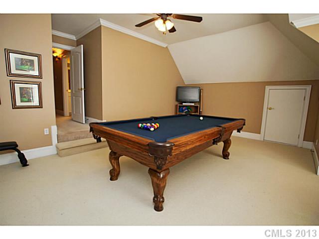 501 St Ives Court Fort Mill, SC 29708 - Photo 14 of 16 a living room with a table and gym equipment