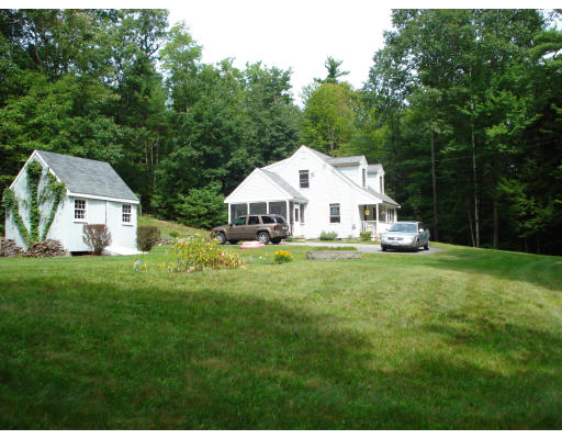 128 Haynes Road Townsend, MA 01469 - Photo 11 of 12 a house view with a garden space