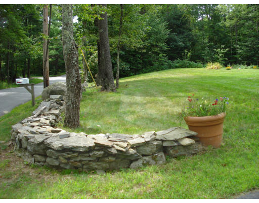 128 Haynes Road Townsend, MA 01469 - Photo 12 of 12 a backyard of a house with yard and outdoor seating