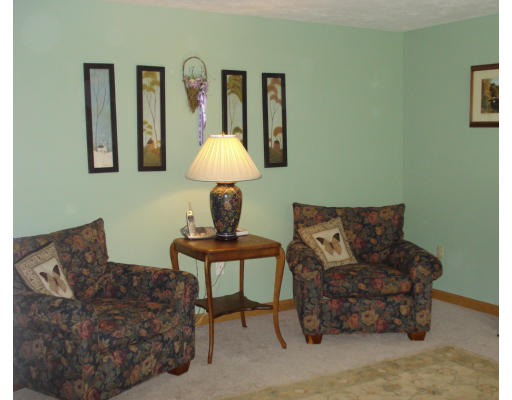 128 Haynes Road Townsend, MA 01469 - Photo 5 of 12 a living room with furniture a lamp and a large window