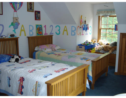 128 Haynes Road Townsend, MA 01469 - Photo 7 of 12 a bed room with a bed and a table