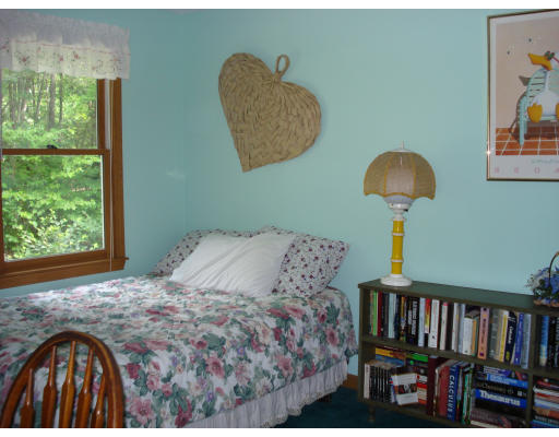 128 Haynes Road Townsend, MA 01469 - Photo 8 of 12 a bedroom with a bed and a window