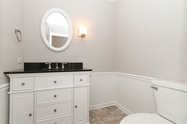 981 West Bauer Road Naperville, IL 60563 - Photo 11 of 21 a bathroom with a sink and a mirror