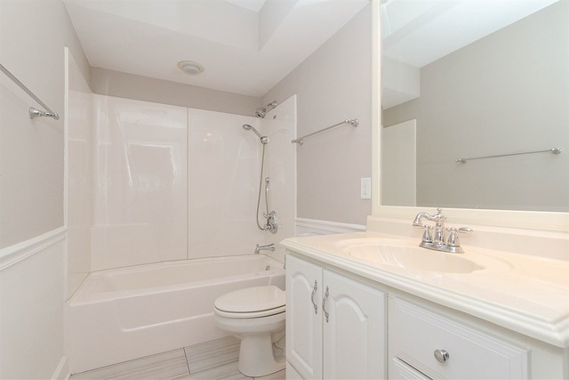 981 West Bauer Road Naperville, IL 60563 - Photo 17 of 21 a bathroom with a sink a toilet and shower