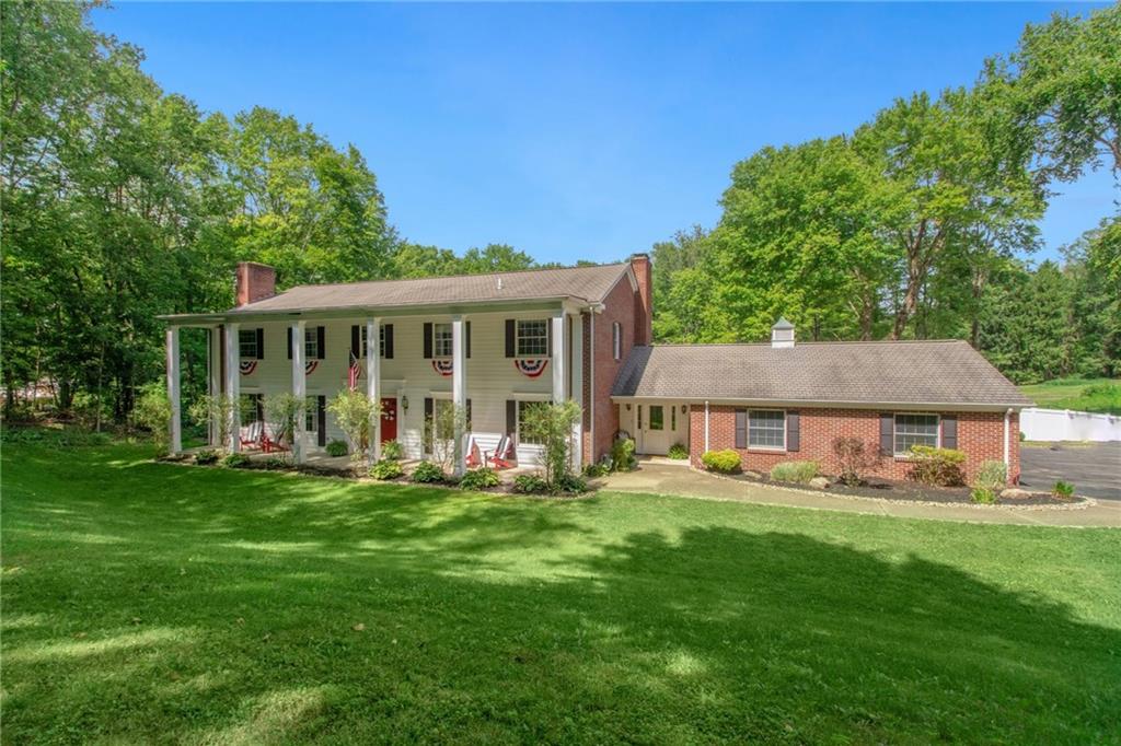 276 Oakville Road Beaver Falls, PA 15010 - Photo 1 of 25 Resting on 6 wooded acres, this spacious & sprawling 5 bedroom 3/2 bath home will capture your heart at 1st sight from the gorgeous bamboo floors & shiplap walls to the German smear brick fireplaces & balconied bedrooms!