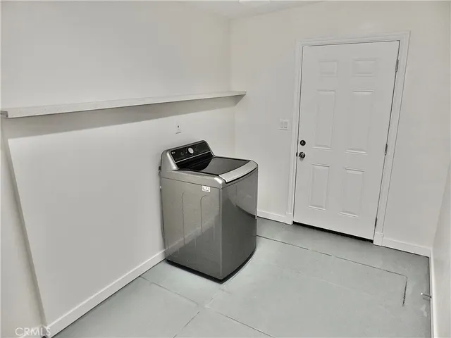 a utility room with washer and dryer