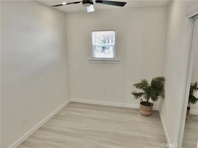 a view of a house with wooden floor and a potted plant