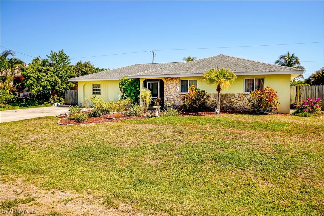 18473 Geranium Road Fort Myers, FL 33967 - Photo 1 of 25 a front view of house with yard