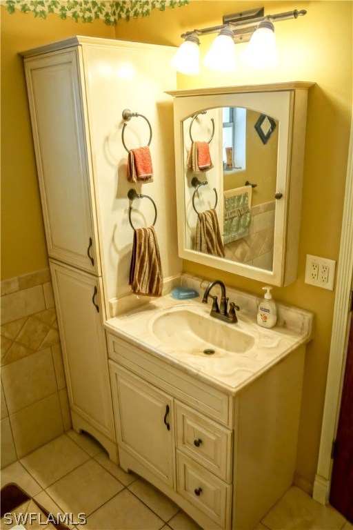 18473 Geranium Road Fort Myers, FL 33967 - Photo 16 of 25 a bathroom with a granite countertop sink and a mirror