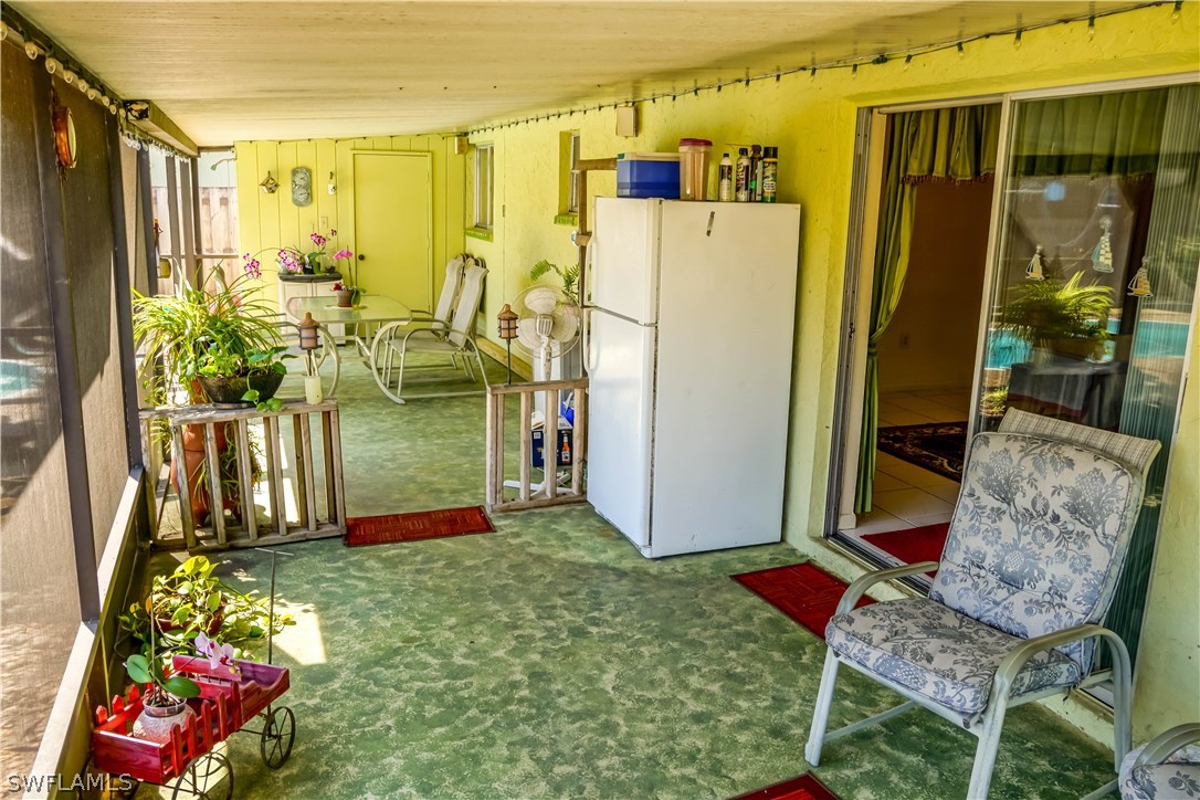 18473 Geranium Road Fort Myers, FL 33967 - Photo 18 of 25 a backyard of a house with seating space