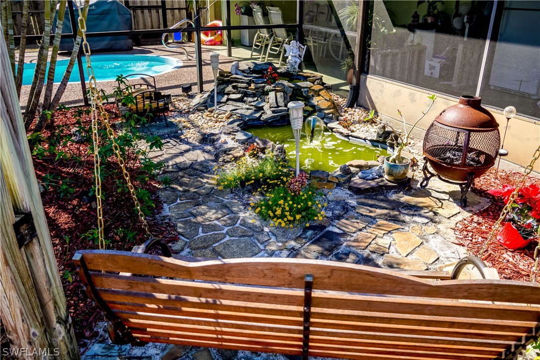 18473 Geranium Road Fort Myers, FL 33967 - Photo 24 of 25 a view of a chairs and table in a outdoor space
