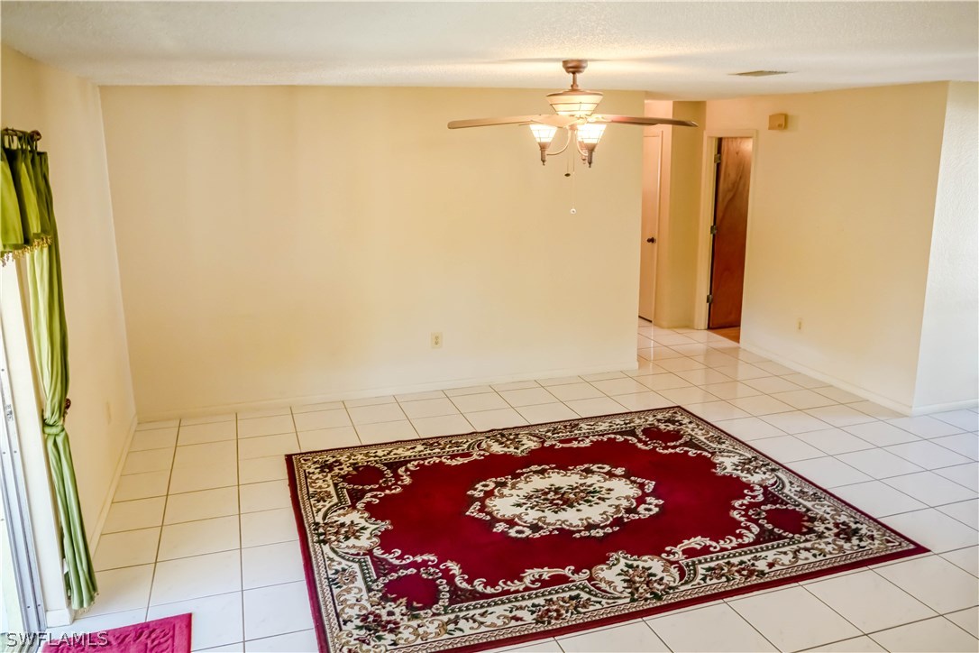 18473 Geranium Road Fort Myers, FL 33967 - Photo 3 of 25 a room with a rug
