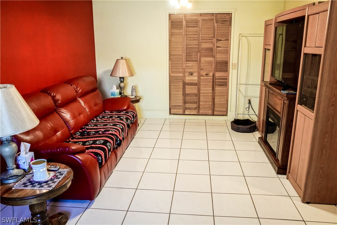 18473 Geranium Road Fort Myers, FL 33967 - Photo 8 of 25 a bedroom with a bed and a window