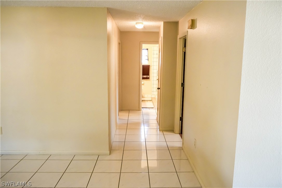 18473 Geranium Road Fort Myers, FL 33967 - Photo 9 of 25 a view of a hallway