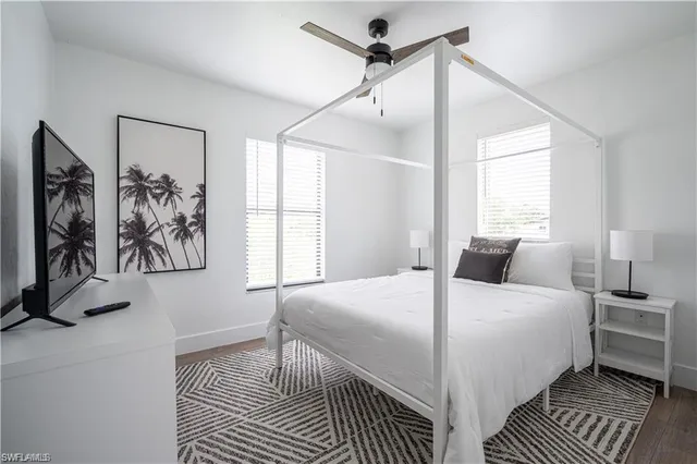 a kitchen with granite countertop a sink stove and cabinets