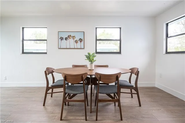 a dining room with furniture and window