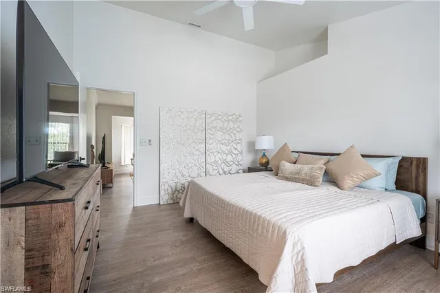 a bedroom with a bed and a table