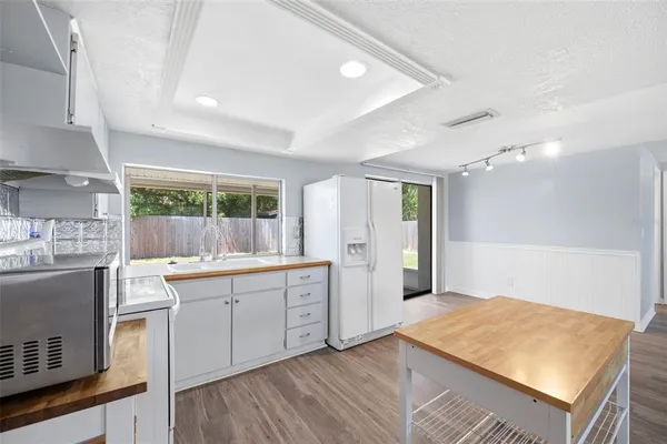 a kitchen with sink and cabinets