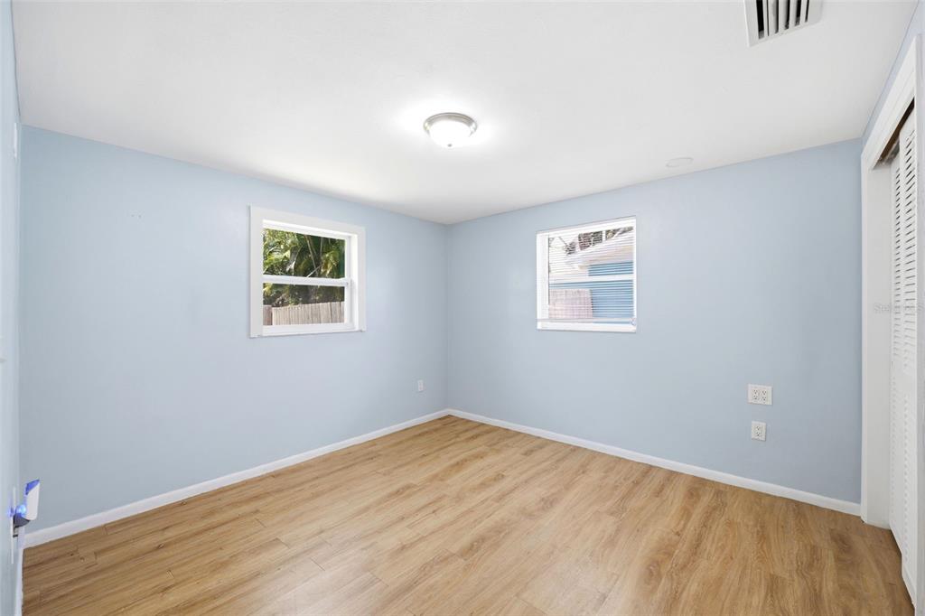 3303 Williamsburg Loop Holiday, FL 34691 - Photo 17 of 31 a view of a room with wooden floor and windows