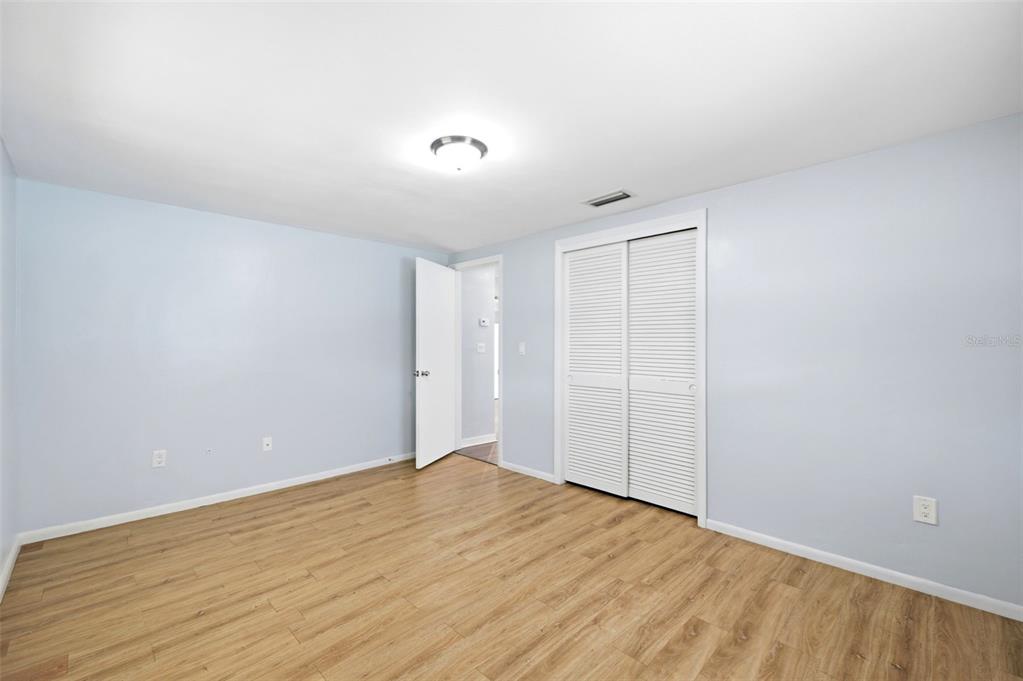 3303 Williamsburg Loop Holiday, FL 34691 - Photo 18 of 31 wooden floor in an empty room