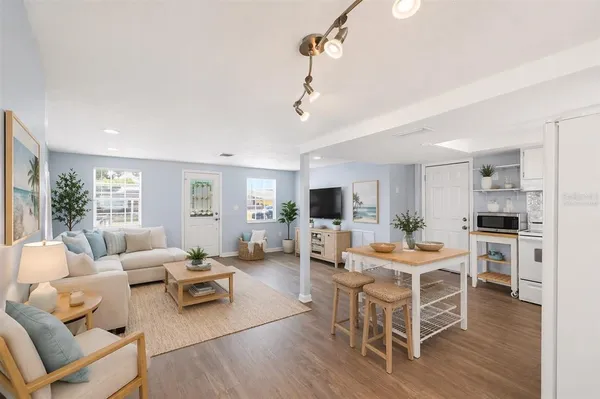 a room with furniture wooden floor and a window