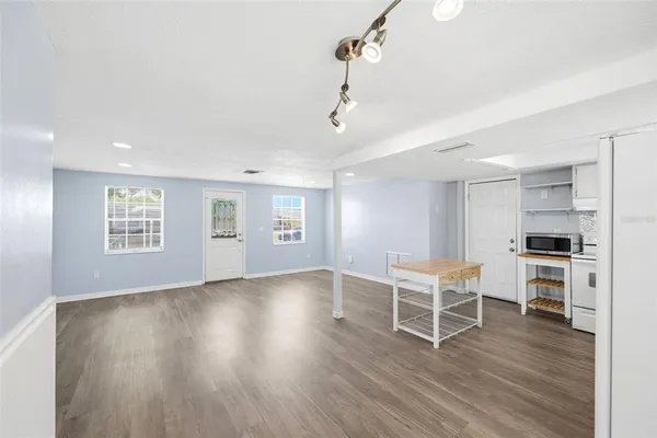 a view of a livingroom with furniture and wooden floor