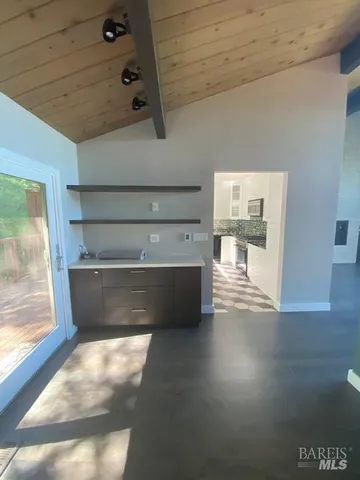 a bathroom with a sink a mirror and a shower