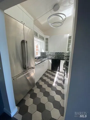 a kitchen with stainless steel appliances wooden cabinets and a counter top space