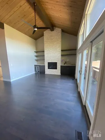 wooden floor in an empty room with a fireplace