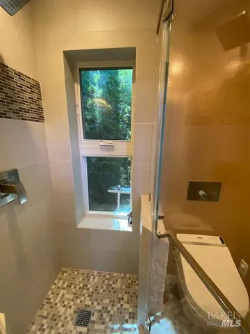 a bathroom with a shower and a bathtub