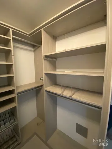 a view of balcony with wooden floor and fence