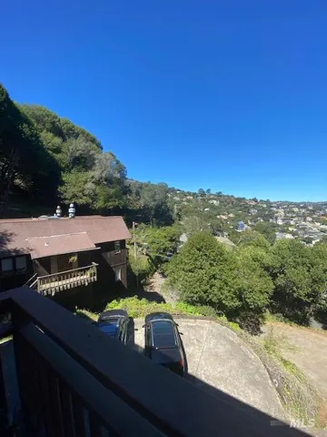 a view of a yard with a mountain