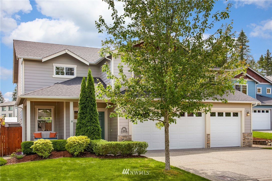 9451 Northeast 173rd Place Bothell, WA 98011 - Photo 1 of 1 a front view of a house with garden
